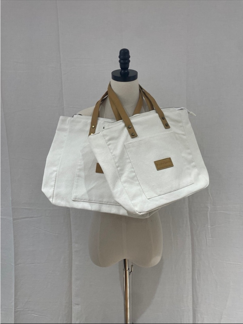 White Canvas Tote with Tan Leather Handles NWOT
This price is for 2 Totes.